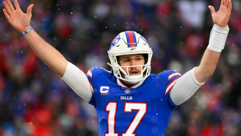 Jan 2, 2022; Orchard Park, New York, USA; Buffalo Bills quarterback Josh Allen (17) reacts to a touchdown against the Atlanta Falcons during the second half at Highmark Stadium. Mandatory Credit: Rich Barnes-USA TODAY Sports