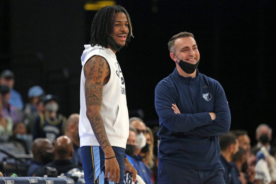 Jan 13, 2022; Memphis, Tennessee, USA; Memphis Grizzles guard Ja Morant (left) and acting head coach Darko Rajakovic (right) react to a foul call during the first half against the Minnesota Timberwolves at FedExForum. Mandatory Credit: Petre Thomas-USA TODAY Sports