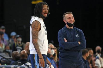 Jan 13, 2022; Memphis, Tennessee, USA; Memphis Grizzles guard Ja Morant (left) and acting head coach Darko Rajakovic (right) react to a foul call during the first half against the Minnesota Timberwolves at FedExForum. Mandatory Credit: Petre Thomas-USA TODAY Sports