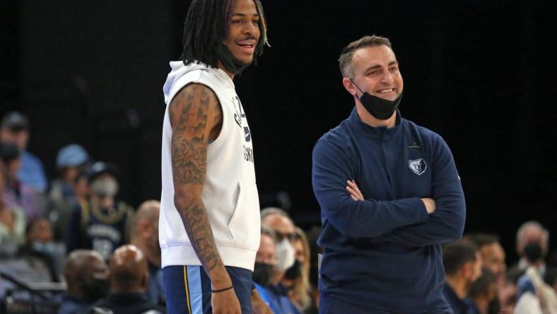 Jan 13, 2022; Memphis, Tennessee, USA; Memphis Grizzles guard Ja Morant (left) and acting head coach Darko Rajakovic (right) react to a foul call during the first half against the Minnesota Timberwolves at FedExForum. Mandatory Credit: Petre Thomas-USA TODAY Sports