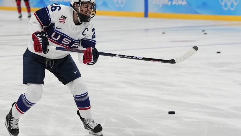 Feb 17, 2022; Beijing, China; Team United States forward Kendall Coyne Schofield (26) shoots a puck during warmups prior to the game against Team Canada during the Beijing 2022 Olympic Winter Games at Wukesong Sports Centre. Mandatory Credit: George Walker IV-USA TODAY Sports