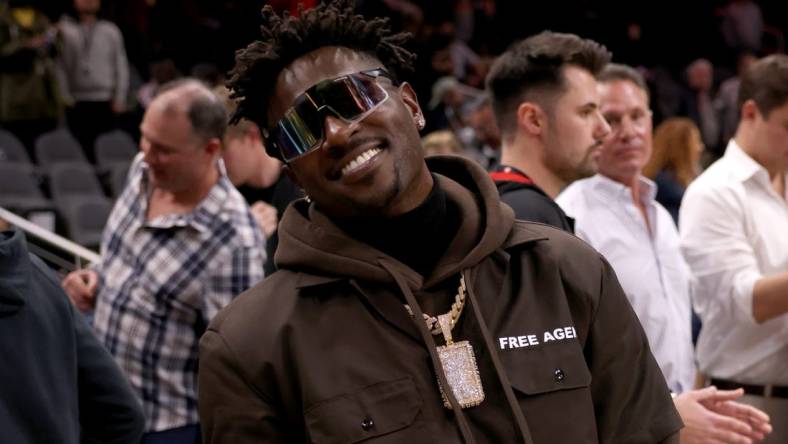 Mar 11, 2022; Atlanta, Georgia, USA; Former Tampa Bay Buccaneers wide receiver Antonio Brown poses for photographers after the game between the Atlanta Hawks and the LA Clippers at State Farm Arena. Mandatory Credit: Jason Getz-USA TODAY Sports