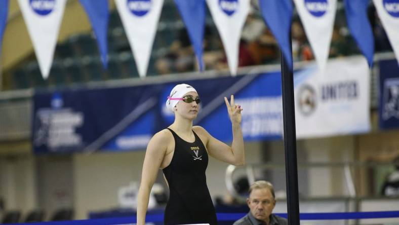 Mar 18, 2022; Atlanta, Georgia, USA; Virginia Cavaliers swimmer Emma Weyant is introduced before the 400 IM at the NCAA Swimming & Diving Championships at Georgia Tech. Mandatory Credit: Brett Davis-USA TODAY Sports