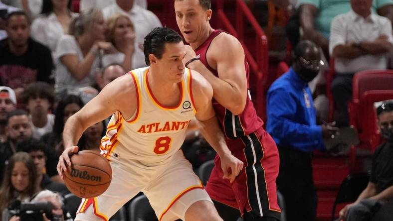 Apr 26, 2022; Miami, Florida, USA; Atlanta Hawks forward Danilo Gallinari (8) dribbles the ball against Miami Heat guard Duncan Robinson (55) during the first half in game five of the first round for the 2022 NBA playoffs at FTX Arena. Mandatory Credit: Jasen Vinlove-USA TODAY Sports