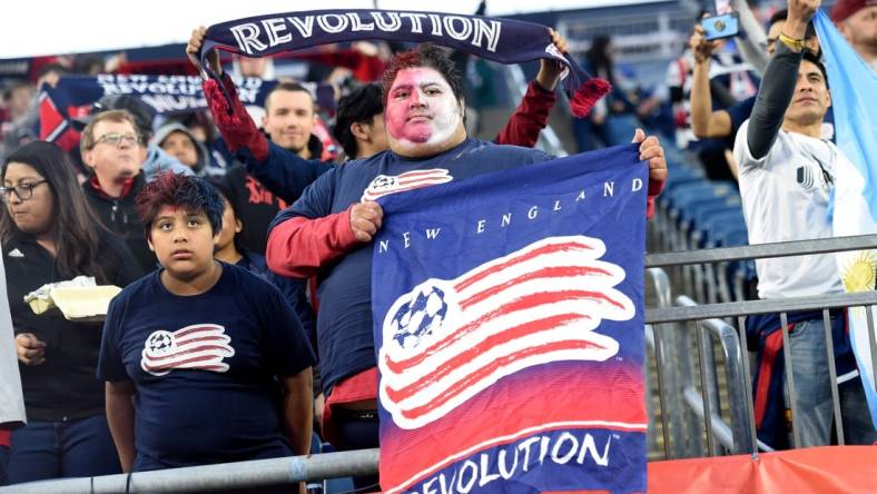 Apr 30, 2022; Foxborough, Massachusetts, USA; A New England Revolution fan holds a banner before a match against Inter Miami at Gillette Stadium. Mandatory Credit: Bob DeChiara-USA TODAY Sports