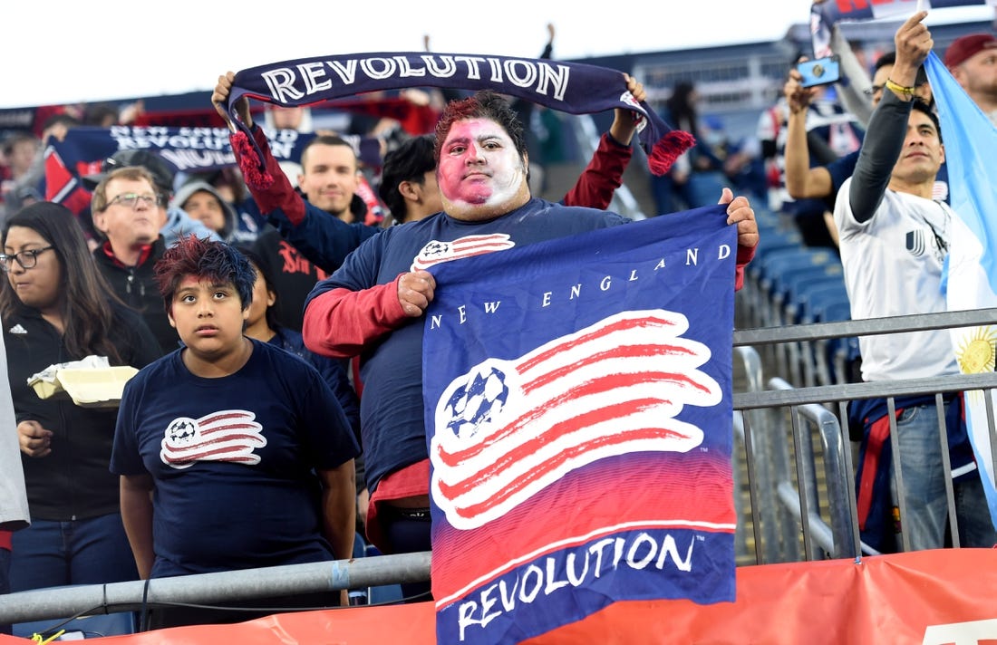 Apr 30, 2022; Foxborough, Massachusetts, USA; A New England Revolution fan holds a banner before a match against Inter Miami at Gillette Stadium. Mandatory Credit: Bob DeChiara-USA TODAY Sports