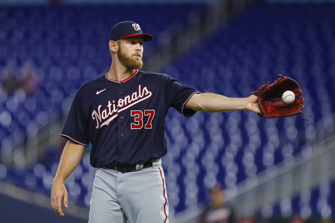 Jun 9, 2022; Miami, Florida, USA; Washington Nationals starting pitcher Stephen Strasburg (37) catches a baseball during the first inning against the Miami Marlins at loanDepot Park. Mandatory Credit: Sam Navarro-USA TODAY Sports