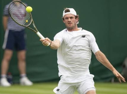 Jun 27, 2022; London, United Kingdom;  Tommy Paul (USA) returns a shot during his first round match against Fernando Verdasco (ESP) on day one at All England Lawn Tennis and Croquet Club. Mandatory Credit: Susan Mullane-USA TODAY Sports