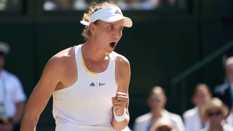 Jul 9, 2022; London, England, United Kingdom;  Elena Rybakina (KAZ)  celebrates on her way to winning her women   s singles final against Ons Jabeur (TUN) on Centre court at All England Lawn Tennis and Croquet Club. Mandatory Credit: Peter van den Berg-USA TODAY Sports