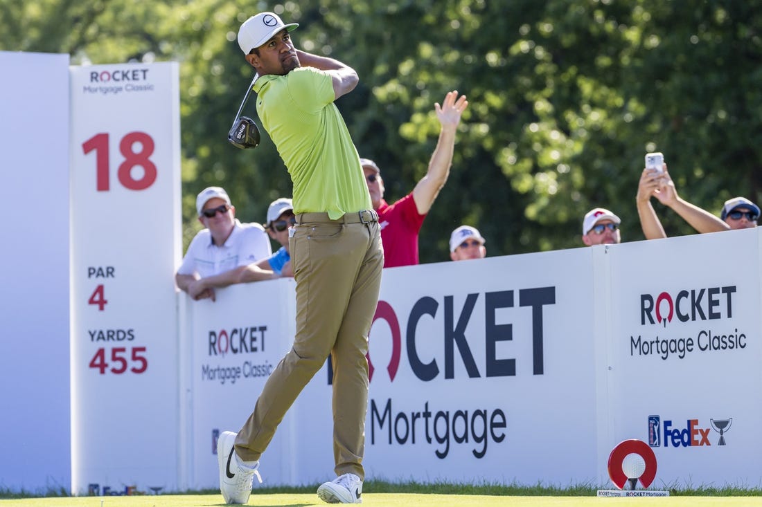 Jul 31, 2022; Detroit, Michigan, USA; Tony Finau hits his tee shot on the par 4 eighteenth hole during the final round of the Rocket Mortgage Classic golf tournament. Mandatory Credit: Raj Mehta-USA TODAY Sports