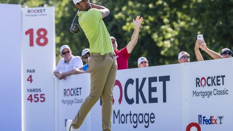 Jul 31, 2022; Detroit, Michigan, USA; Tony Finau hits his tee shot on the par 4 eighteenth hole during the final round of the Rocket Mortgage Classic golf tournament. Mandatory Credit: Raj Mehta-USA TODAY Sports