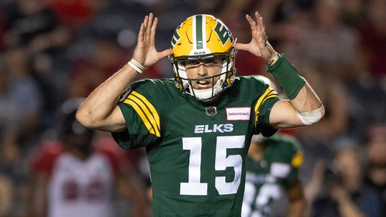 Aug 19, 2022; Ottawa, Ontario, CAN; Edmonton Elks quarterback Taylor Cornelius (15) calls a play in the second half against the Ottawa REDBLACKS at the TD Place stadium. Mandatory Credit: Marc DesRosiers-USA TODAY Sports