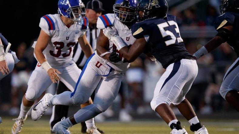 Dion Stutts (62) of MUS and Tre Jones (53) of Arlington  during the game between the Arlington Tigers and MUS Owls on Friday August, 19th 2022 in Arlington, Tn (Justin Ford/Special to the Commercial Appeal)

Arlingtonvsmus0020