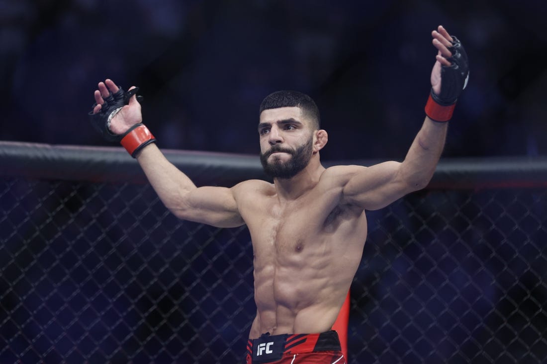 Aug 20, 2022; Salt Lake City, Utah, USA; Amir Albazi (red gloves) reacts after defeating Francisco Figueiredo (blue gloves) during UFC 278 at Vivint Arena. Mandatory Credit: Jeffrey Swinger-USA TODAY Sports