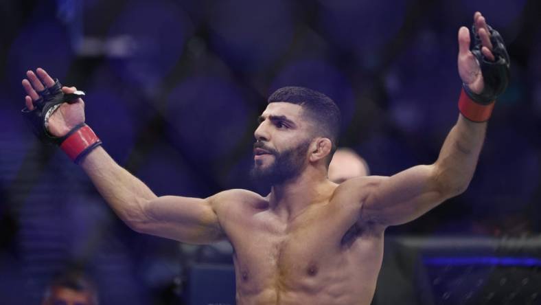 Aug 20, 2022; Salt Lake City, Utah, USA; Amir Albazi (red gloves) reacts after defeating Francisco Figueiredo (blue gloves) during UFC 278 at Vivint Arena. Mandatory Credit: Jeffrey Swinger-USA TODAY Sports