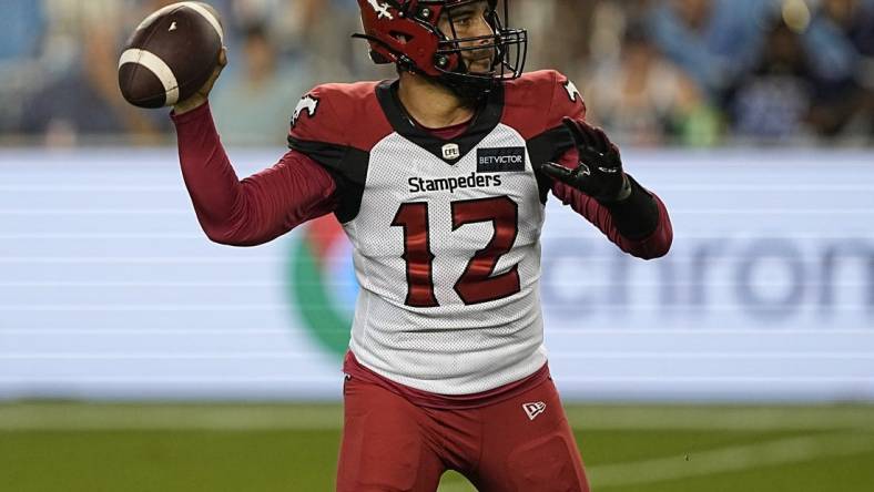 Aug 20, 2022; Toronto, Ontario, CAN; Calgary Stampeders quarterback Jake Maier (12) throws against the Toronto Argonauts during the second half at BMO Field. Mandatory Credit: John E. Sokolowski-USA TODAY Sports