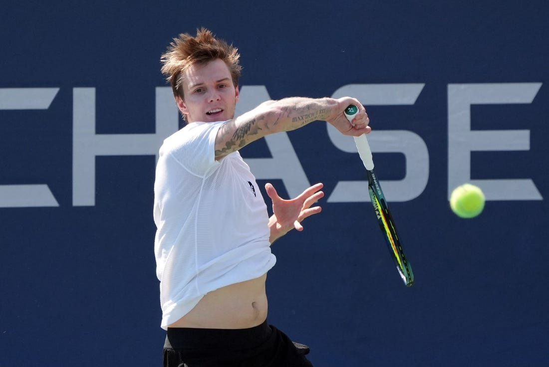 Aug 31, 2022; Flushing, NY, USA;  Alexander Bublik of Kazakhstan hits a shot against Pablo Carreno Busta of Spain on day three of the 2022 U.S. Open tennis tournament at USTA Billie Jean King Tennis Center. Mandatory Credit: Jerry Lai-USA TODAY Sports