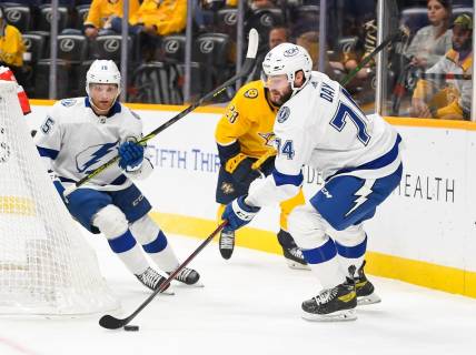 Sep 30, 2022; Nashville, Tennessee, USA;  Tampa Bay Lightning defenseman Sean Day (74) clears the puck against the Nashville Predators during the first period at Bridgestone Arena. Mandatory Credit: Steve Roberts-USA TODAY Sports