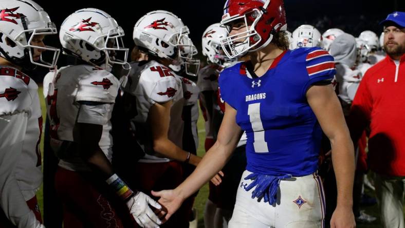 Jefferson's Sammy Brown (1) shakes hands with Loganville players after a GHSA high school football game between Jefferson and Loganville in Jefferson, Ga., on Friday, Oct. 21, 2022. Jefferson won 42-6.

News Joshua L Jones