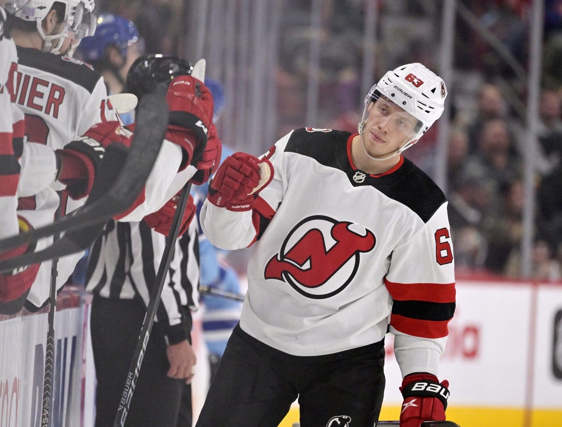 Nov 15, 2022; Montreal, Quebec, CAN; New Jersey Devils forward Jesper Bratt (63) celebrates with teammates after scoring a goal against the Montreal Canadiens during the third period at the Bell Centre. Mandatory Credit: Eric Bolte-USA TODAY Sports