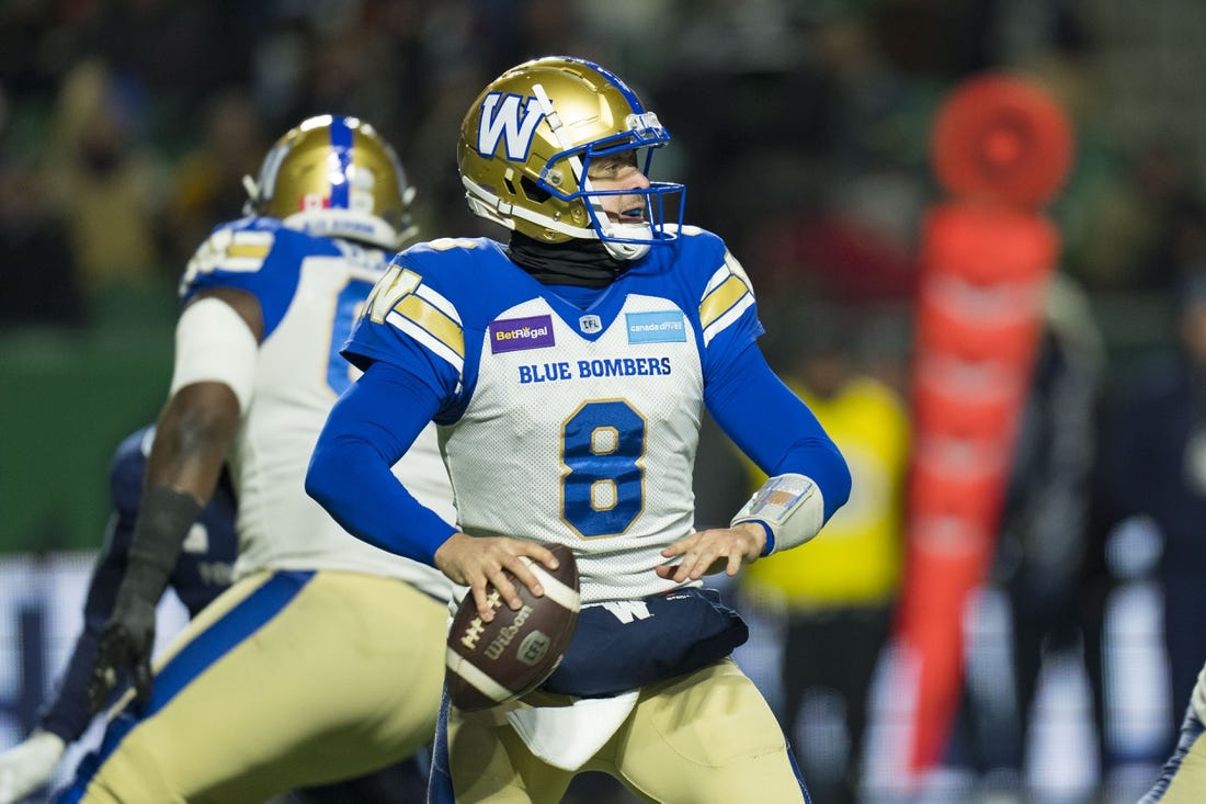 Nov 20, 2022; Regina, Saskatchewan, CAN;  Winnipeg Blue Bombers quarterback Zach Collaros (8) drops back to pass against the Toronto Argonauts in the second half. The Argonauts defeated the Blue Bombers to win the 2022 Grey Cup Championship at Mosaic Stadium. Toronto won 24-23. Mandatory Credit: Bob Frid-USA TODAY Sports