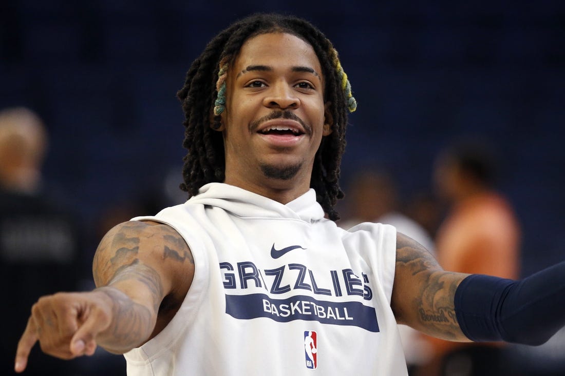 Nov 22, 2022; Memphis, Tennessee, USA; Memphis Grizzlies guard Ja Morant (12) smiles after a shot during warm ups prior to the game against the Sacramento Kings at FedExForum. Mandatory Credit: Petre Thomas-USA TODAY Sports