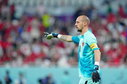 Dec 1, 2022; Doha, Qatar; Canada goalkeeper Milan Borjan (18) gestures against Morocco during the second half of a group stage match during the 2022 World Cup at Al Thumama Stadium. Mandatory Credit: Danielle Parhizkaran-USA TODAY Sports