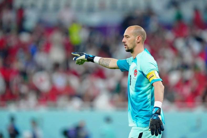 Dec 1, 2022; Doha, Qatar; Canada goalkeeper Milan Borjan (18) gestures against Morocco during the second half of a group stage match during the 2022 World Cup at Al Thumama Stadium. Mandatory Credit: Danielle Parhizkaran-USA TODAY Sports