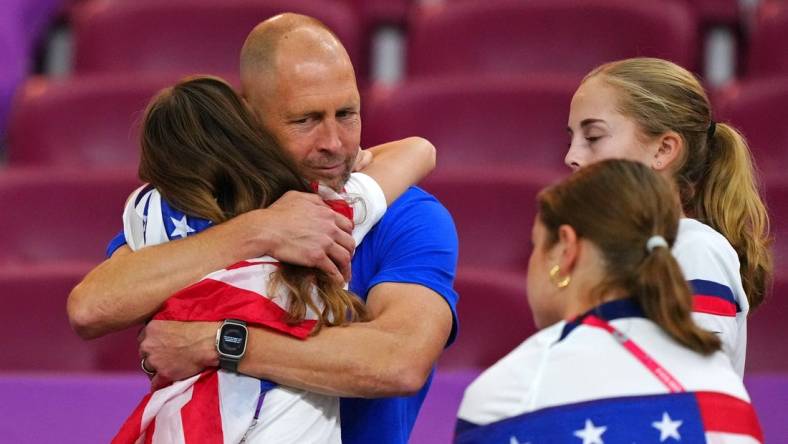 Dec 3, 2022; Al Rayyan, Qatar; United States of America manager Gregg Berhalter with family after losing a round of sixteen match against the Netherlands in the 2022 FIFA World Cup at Khalifa International Stadium. Mandatory Credit: Danielle Parhizkaran-USA TODAY Sports