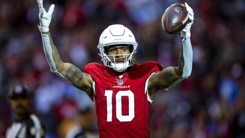 Nov 27, 2022; Glendale, Arizona, USA;  Arizona Cardinals wide receiver DeAndre Hopkins (10) celebrates after scoring a touchdown against the Los Angeles Chargers in the first half at State Farm Stadium. Mandatory Credit: Mark J. Rebilas-USA TODAY Sports