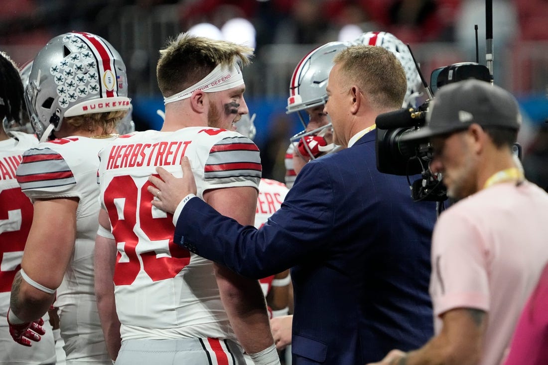 Dec 31, 2022; Atlanta, Georgia, USA; ESPN announcer Kirk Herbstreit talks to his son, Ohio State Buckeyes tight end Zak Herbstreit (89), prior to the Peach Bowl in the College Football Playoff semifinal at Mercedes-Benz Stadium. Mandatory Credit: Adam Cairns-The Columbus Dispatch

Ncaa Football Peach Bowl Ohio State At Georgia