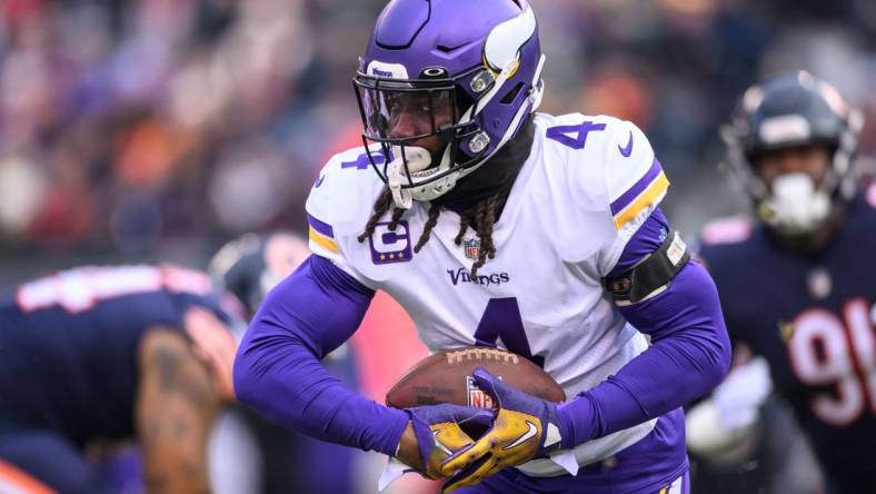 Jan 8, 2023; Chicago, Illinois, USA; Minnesota Vikings running back Dalvin Cook (4) runs the ball during the first quarter against the Chicago Bears at Soldier Field. Mandatory Credit: Daniel Bartel-USA TODAY Sports