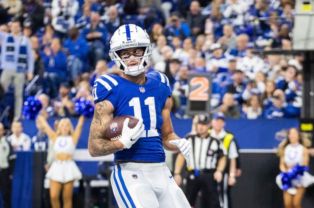 Jan 8, 2023; Indianapolis, Indiana, USA; Indianapolis Colts wide receiver Michael Pittman Jr. (11) scores a touchdown in the first quarter against the Houston Texans at Lucas Oil Stadium. Mandatory Credit: Trevor Ruszkowski-USA TODAY Sports