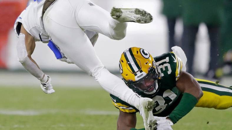 Green Bay Packers safety Adrian Amos (31) upends Detroit Lions wide receiver Kalif Raymond (11) during their football game on Sunday, January, 8, 2022 at Lambeau Field in Green Bay, Wis. Wm. Glasheen USA TODAY NETWORK-Wisconsin

Apc Packers Vs Lions 5226 010823 Wag