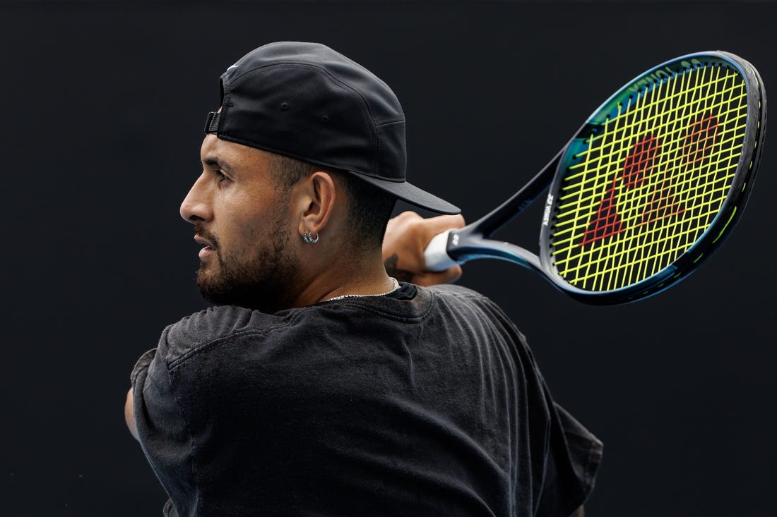 Jan 15, 2023; Melbourne, Victoria, Australia; Nick Kyrgios of Australia hits a shot during a practice session on court 16 at Melbourne Park. Mandatory Credit: Mike Frey-USA TODAY Sports