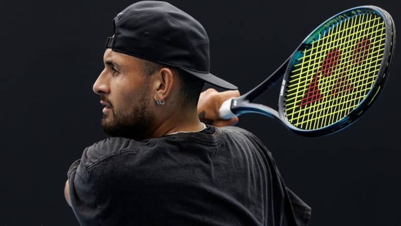 Jan 15, 2023; Melbourne, Victoria, Australia; Nick Kyrgios of Australia hits a shot during a practice session on court 16 at Melbourne Park. Mandatory Credit: Mike Frey-USA TODAY Sports