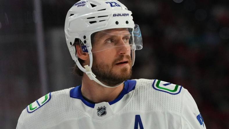 Jan 15, 2023; Raleigh, North Carolina, USA;  Vancouver Canucks defenseman Oliver Ekman-Larsson (23) looks on against the Carolina Hurricanes during the third period at PNC Arena. Mandatory Credit: James Guillory-USA TODAY Sports