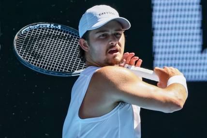 Jan 23, 2023; Melbourne, Victoria, Australia; J.J Wolf from the United States during his round four match against Ben Shelton from the United States on day eight of the 2023 Australian Open tennis tournament at Melbourne Park. Mandatory Credit: Mike Frey-USA TODAY Sports