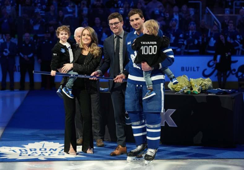 Jan 29, 2023; Toronto, Ontario, CAN; Toronto Maple Leafs center John Tavares (91) receives a commemorative hockey stick from Toronto Maple Leafs General Manager Kyle Dubas for his1000th NHL game ceremony against the Washington Capitals at Scotiabank Arena. Mandatory Credit: Nick Turchiaro-USA TODAY Sports