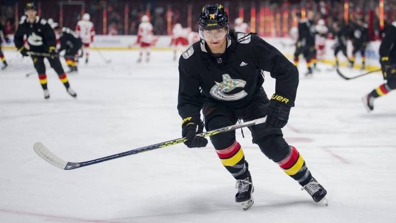 Feb 13, 2023; Vancouver, British Columbia, CAN; Vancouver Canucks defenseman Ethan Bear (74) skates during warm up prior to a game against the Detroit Red Wings at Rogers Arena. Mandatory Credit: Bob Frid-USA TODAY Sports