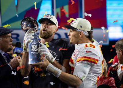 Feb 12, 2023; Glendale, Arizona, US; Kansas City Chiefs quarterback Patrick Mahomes (right) and tight end Travis Kelce celebrate with the Vince Lombardi Trophy after defeating the Philadelphia Eagles during Super Bowl LVII at State Farm Stadium. Mandatory Credit: Mark J. Rebilas-USA TODAY Sports