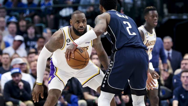 Feb 26, 2023; Dallas, Texas, USA; Los Angeles Lakers forward LeBron James (6) guards Dallas Mavericks guard Kyrie Irving (2) during the fourth quarter at American Airlines Center. Mandatory Credit: Kevin Jairaj-USA TODAY Sports