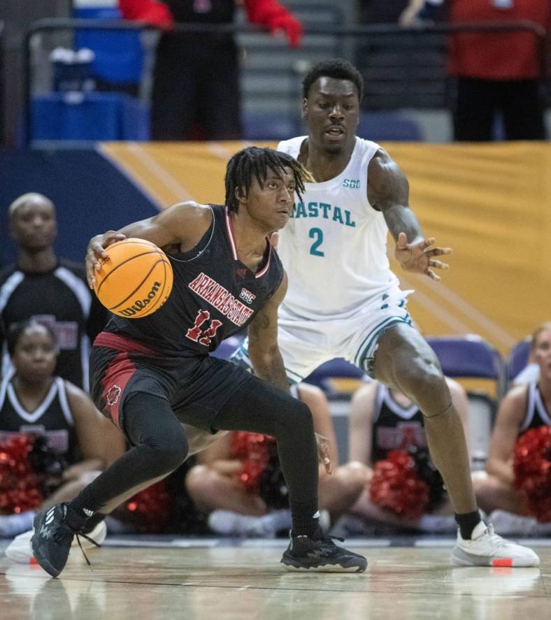 Terrance Ford Jr. (11) controls the ball during the Coastal Carolina vs. Arkansas State men   s basketball game in the first round of the Sun Belt Basketball Championship tournament at the Bay Center in Pensacola on Tuesday, Feb. 28, 2023.

Coastal Carolina Vs Arkansas State Men S Basketball
