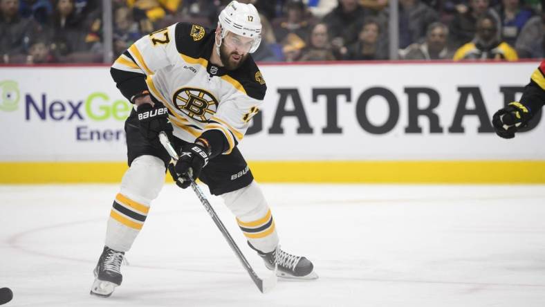 Feb 25, 2023; Vancouver, British Columbia, CAN;  Boston Bruins forward Nick Foligno (17) skates with the puck the Vancouver Canucks during the second period at Rogers Arena. Mandatory Credit: Anne-Marie Sorvin-USA TODAY Sports