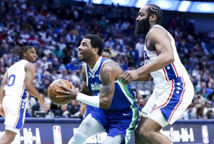 Mar 2, 2023; Dallas, Texas, USA;  Dallas Mavericks guard Kyrie Irving (2) drives to the basket past Philadelphia 76ers guard James Harden (1) during the first quarter at American Airlines Center. Mandatory Credit: Kevin Jairaj-USA TODAY Sports