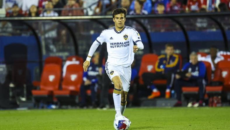 Mar 4, 2023; Frisco, Texas, USA;  Los Angeles Galaxy midfielder Riqui Puig (6) dribbles the ball during the second half against FC Dallas at Toyota Stadium. Mandatory Credit: Kevin Jairaj-USA TODAY Sports