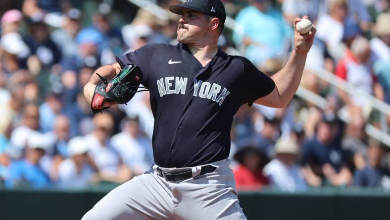 Mar 5, 2023; North Port, Florida, USA; New York Yankees starting pitcher Carlos Rodon (55) throws a pitch during the first inning against the Atlanta Braves at CoolToday Park. Mandatory Credit: Kim Klement-USA TODAY Sports