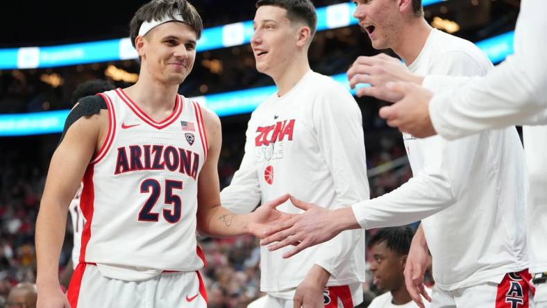 Mar 9, 2023; Las Vegas, NV, USA; Arizona Wildcats guard Kerr Kriisa (25) returns to the bench after a shift against the Stanford Cardinal during the second half at T-Mobile Arena. Mandatory Credit: Stephen R. Sylvanie-USA TODAY Sports