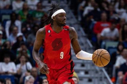 Mar 12, 2023; New Orleans, Louisiana, USA; Portland Trail Blazers forward Jerami Grant (9) brings the ball up court against the New Orleans Pelicans during the first half at Smoothie King Center. Mandatory Credit: Stephen Lew-USA TODAY Sports