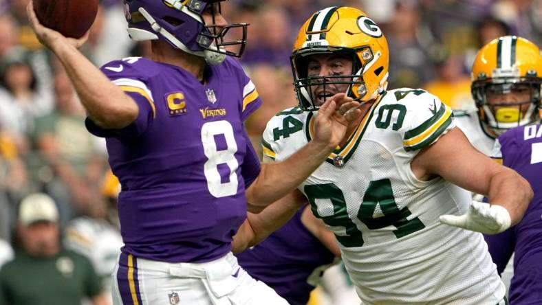 Green Bay Packers defensive end Dean Lowry (94) pressures Minnesota Vikings quarterback Kirk Cousins (8) during the first quarter of their game Sunday, September 11, 2022 at U.S. Bank Stadium in Minneapolis, Minn.

Mjs Packers11 31 Jpg Packers11 114211850